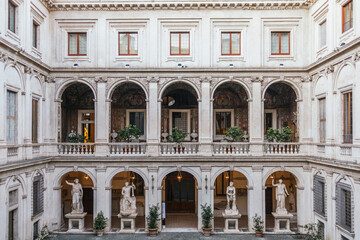 Elegant architecture of historic Roman courtyard with statues
