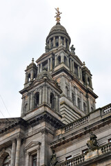Fototapeta premium Ornate Classical Style Tower and Cupola on Stone Public Building seen from Below