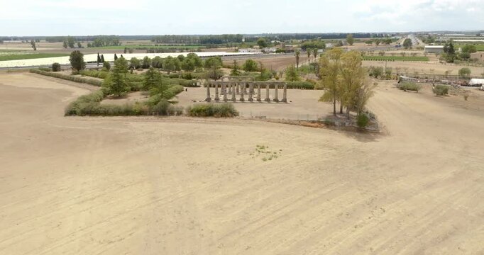 Aerial view of the Tavole Palatine ("Palatine Tables") archaeological park located in Metaponto, Basilicata, Italy. They are the remains of a hexastyle peripteral Greek temple of Magna Graecia.
