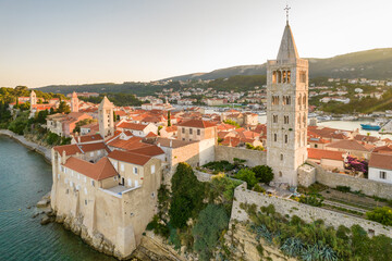 Obraz premium HIstoric towers of a Rab town on Rab island at sunset, Croatia.