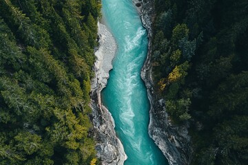 Aerial view of a turquoise river winding through rocky mountains in British Columbia. AI generated illustration