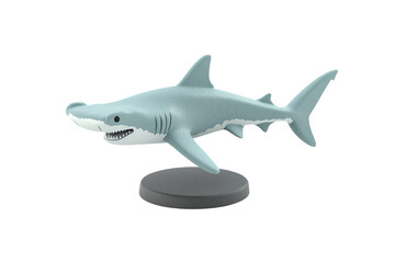 Naklejka premium A stylized model of a shark with a sleek body, sharp teeth, and a playful expression, mounted on a circular stand.