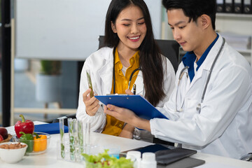 Team Microbiologists Analyzing Molecular Samples in Advanced Food Science Laboratory, Dietitian...