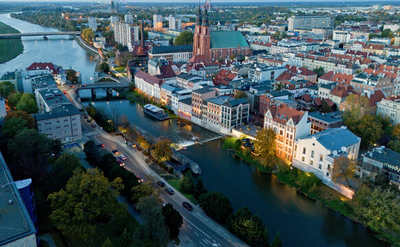 Cityscape of Odra river, bridges and big church with two towers in old town of city Opole Poland from drone