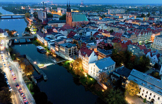 Blue hour view of river Odra with bridges in city Opole Poland from drone