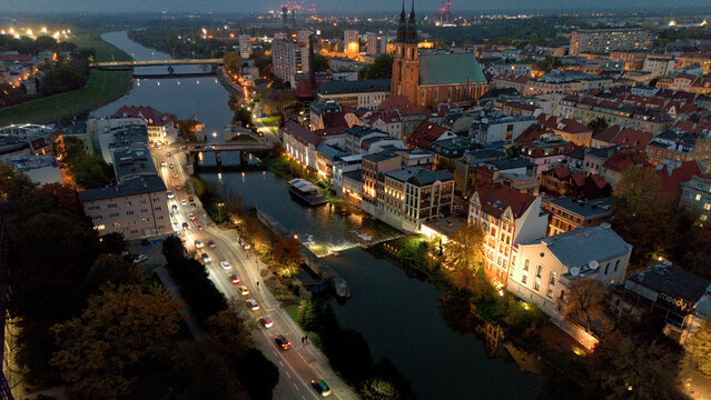 Night time view of river Odra with bridges in city Opole Poland from drone