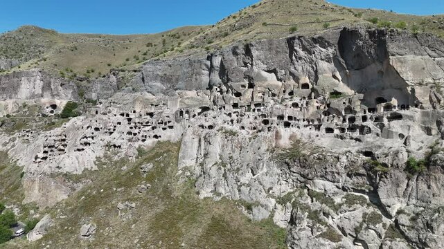 Aerial view of Vardzia - ancient city complex and cave monastery, carved into Erusheti rocky mountain in Georgia. UNESCO World Heritage tentative list.