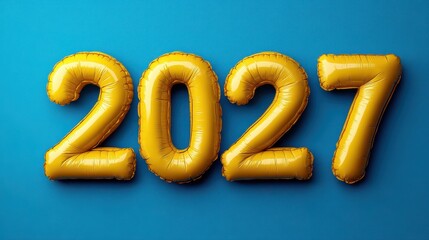 Bright yellow inflatable letters display the year 2027 against a blue background