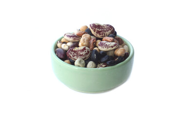 A variety of beans in a cup, such as red, black, black-eyed white, green peas, white peas, peas, tiger, sippeas, azuki beans other.