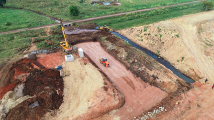 Obraz premium Aerial View of Heavy Machinery in Action on Construction Site