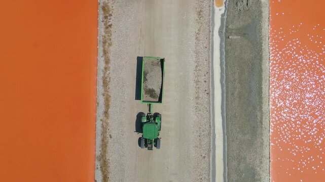 A drone-captured top-down view of a truck moving through the Salt Lake of Vlor&euml; in Albania