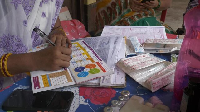 Women child nutrition workers and ASHA workers organising polio vaccination for newborn kids in rural parts of Bihar