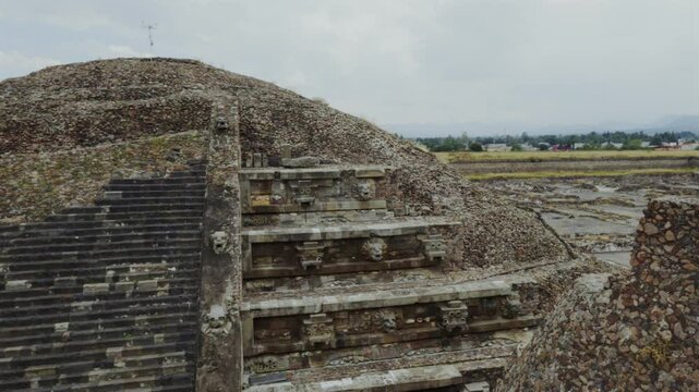 Temple of Quetzalcoatl Feathered Serpent at Teotihuac&aacute;n in Mexico. Pan left view of the Quetzalcoatl and Tlaloc figures