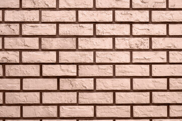 Fototapeta premium Mocha-Mousse brick wall texture, showcasing intricate patterns and earthy tones in Pantone's 2025 color.