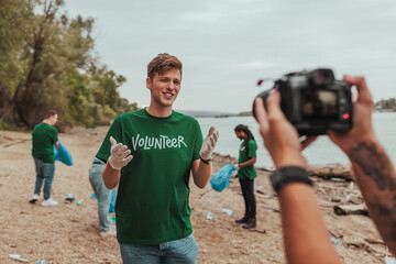 Volunteer talking to camera while cleaning beach with team