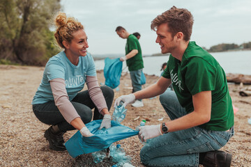 Volunteers collecting plastic bottles on river bank