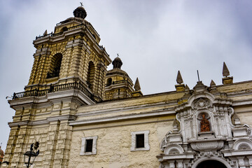 Tower and facade of San Francisco Church in Lima showcasing colonial beauty