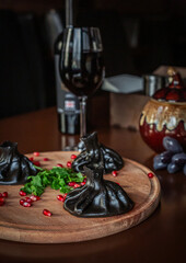 black khinkali on a restaurant table