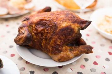 Whole roasted chicken on a plate