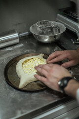 cooking khachapuri in the restaurant kitchen