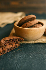 Homemade cookies in a wooden plate, background