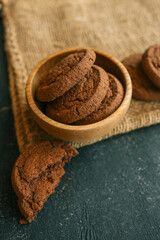 Chocolate brownie cookies in a wooden plate, sweets