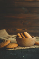 Homemade cookies in a wooden plate, background