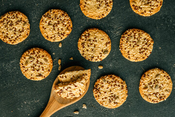 Wooden spoon with homemade cookies with siftings and flax