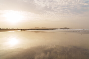 Beautiful Farmaca sandy beach in golden sunset at Lanzarote, Canary Island