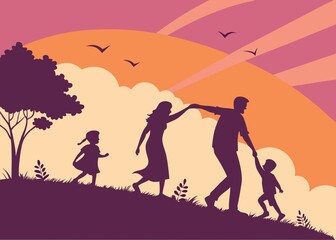 Fototapeta premium Silhouette of a family walking together on a grassy hill against a vibrant orange and red sunset sky