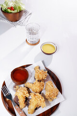 Fried Chicken Drumsticks and Vegetable Salad food on a white background