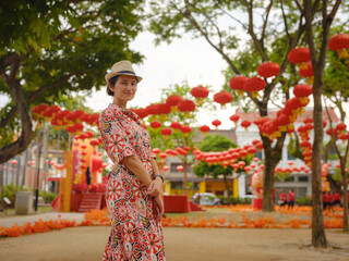 woman exploring streets of George Town, during Chinese New Year.