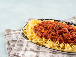 Tagliatelle with vegan tomato bolognese ragu with soya protein granules
