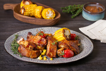 Barbecue grilled pork spare ribs with vegetables on a plate