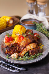 Barbecue grilled pork spare ribs with vegetables on a plate