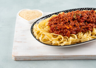 Tagliatelle with vegan tomato bolognese ragu with soya protein granules