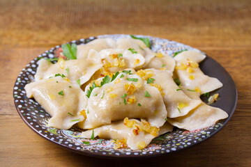 Dumplings with minced meat filling. Varenyky, vareniki, pierogi, pyrohy - dumplings with filling