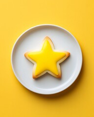 Star-shaped yellow cookie on a white plate