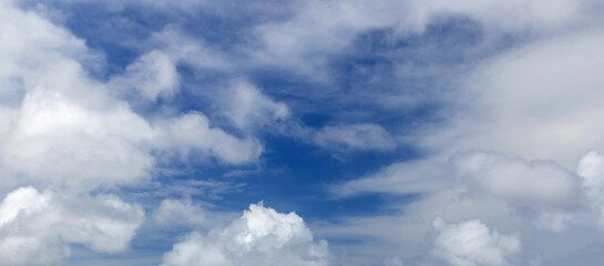 Clouds are in blue sky on a daytime. Natural panoramic background