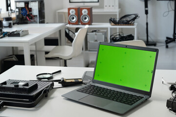 Displaying Technology Equipment with Green Screen Laptop