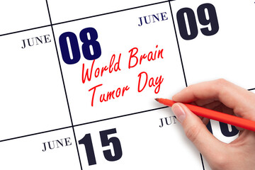 June 8. Hand writing text World Brain Tumor Day on calendar date. Save the date.