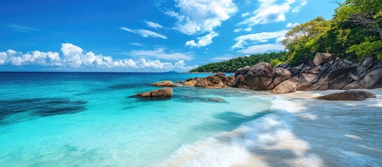 Serene Rocky Seascape with Turquoise Waters Under a Bright Sky Featuring Long Exposure Technique for a Dreamy Effect