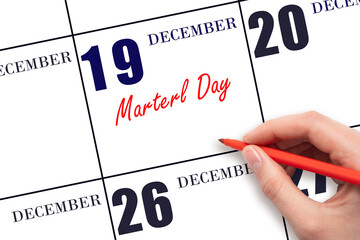 December 19. Hand writing text Marterl Day on calendar date. Save the date.