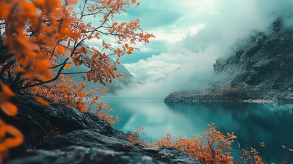 Serene landscape with vibrant orange foliage and tranquil teal waters surrounded by misty mountains and cloudy skies