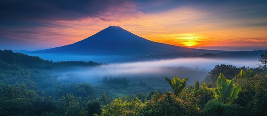 Serene sunrise over misty mountains showcasing vibrant colors and tranquil landscapes in a natural picturesque setting.