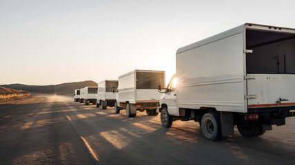 Empty aid trucks on a desolate desert road, symbolizing the gap between humanitarian efforts and the harsh realities of crisis zones
