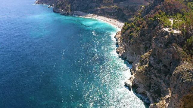 Aerial view of the wonderful Cala del Moraig and Cala de los Tiestos, located between the beautiful cliffs of the town of Benitachell, in the Mediterranean province of Alicante, Spain.