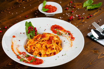 Fettuccine pasta with homemade tomato sauce. Italian pasta with an elegant presentation.