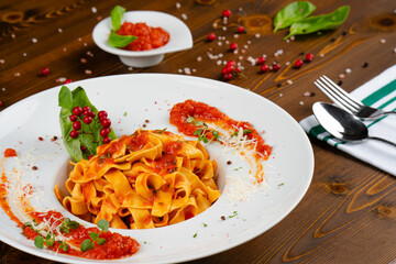 Fettuccine pasta with homemade tomato sauce. Italian pasta with an elegant presentation.