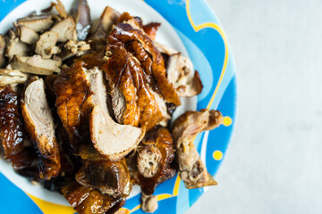 Slice of savoury crispy roast duck served on dish